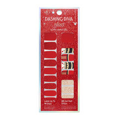 Dashing Diva Toy Soldier nail strips on nails with festive red and gold accents.