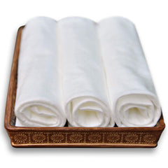DAVELEN towels folded to showcase spa quality softness for facial and body services.