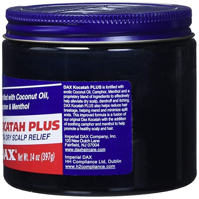 DAX Kocatah applying pomade on scalp for smooth, manageable hair.