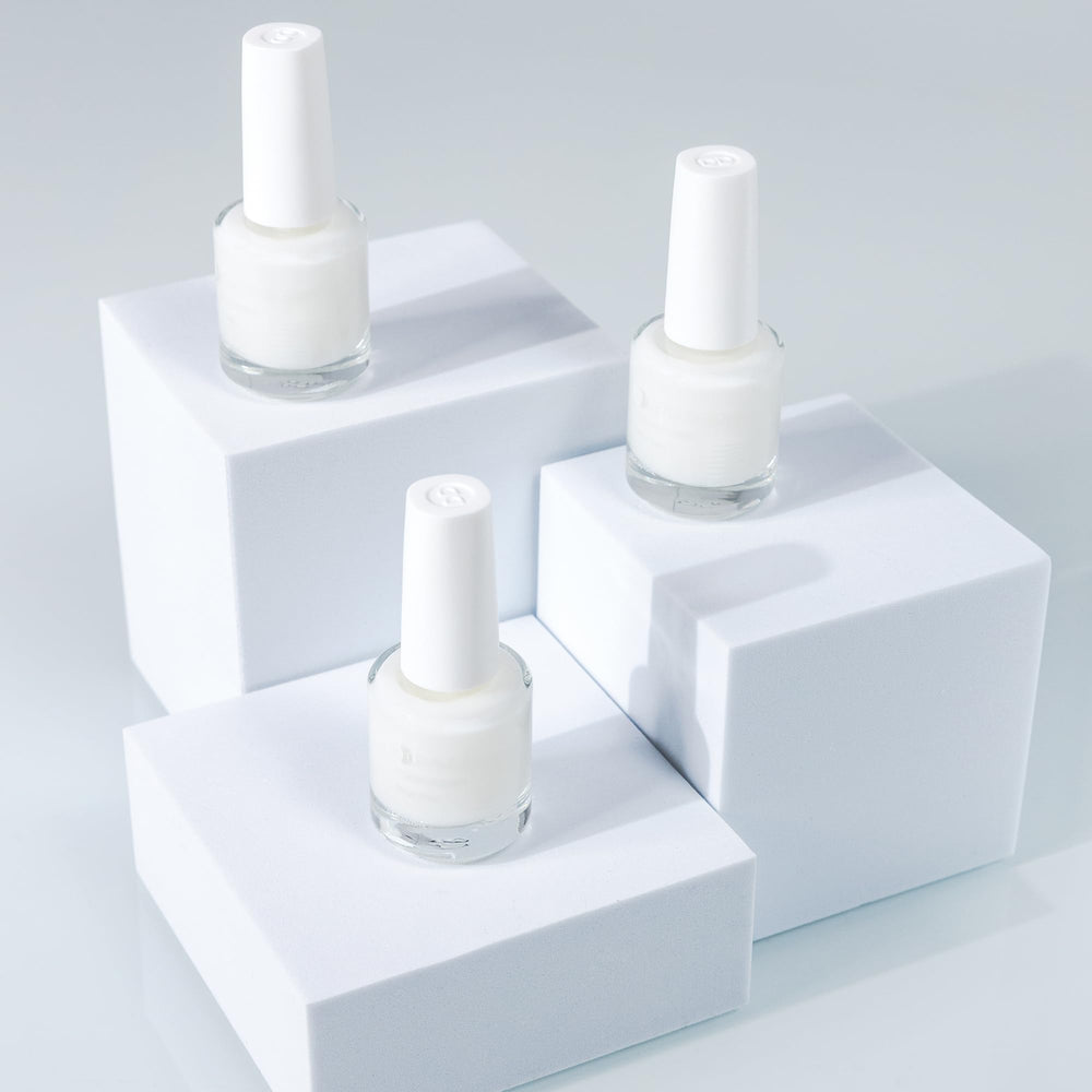 Dazzle Dry Base Coat bottle with a clear layer to boost adhesion.