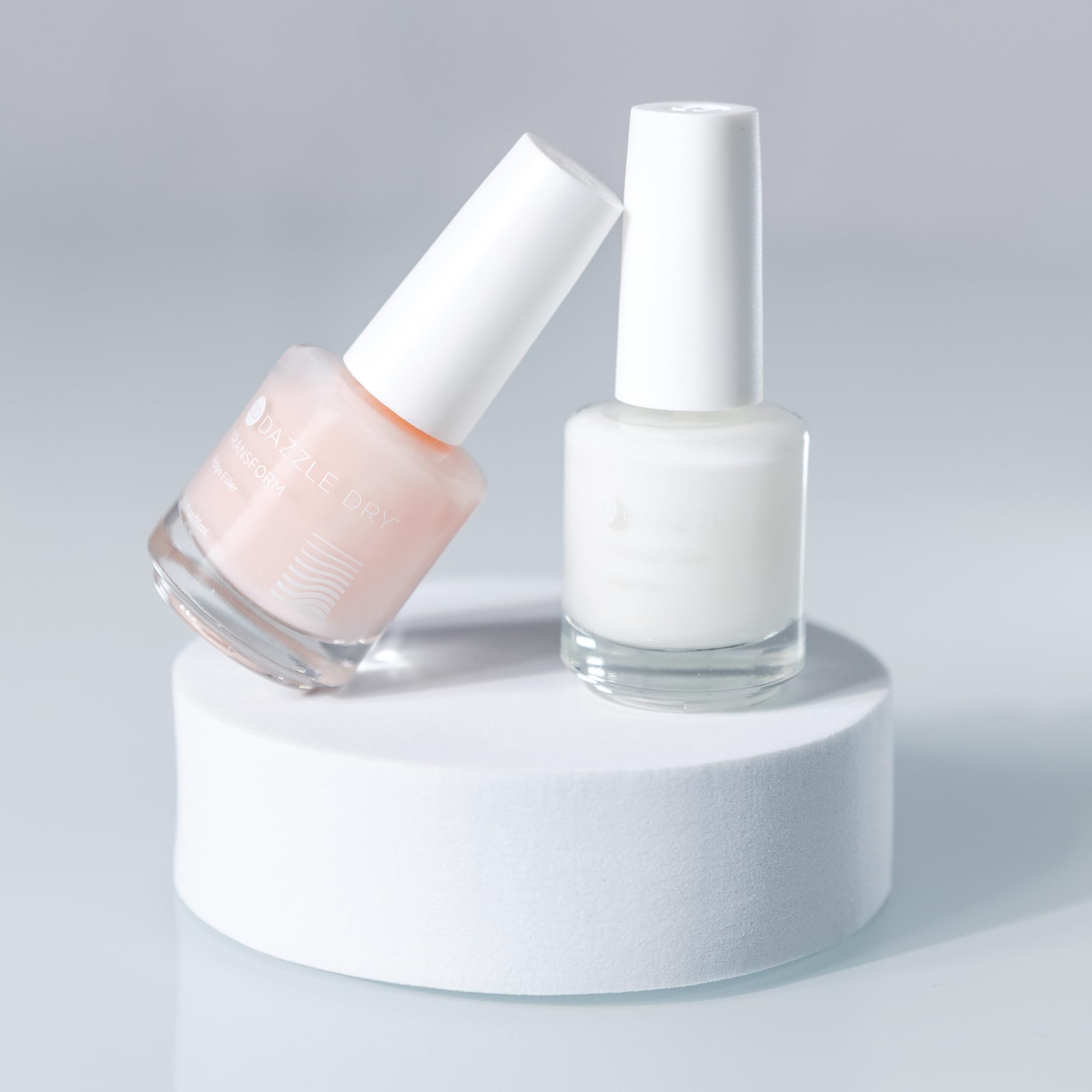 Dazzle Dry Top Coat bottle seals shine and durability.
