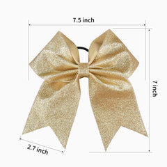 DEEKA glitter bow close-up highlights shimmering gold finish for standout routines