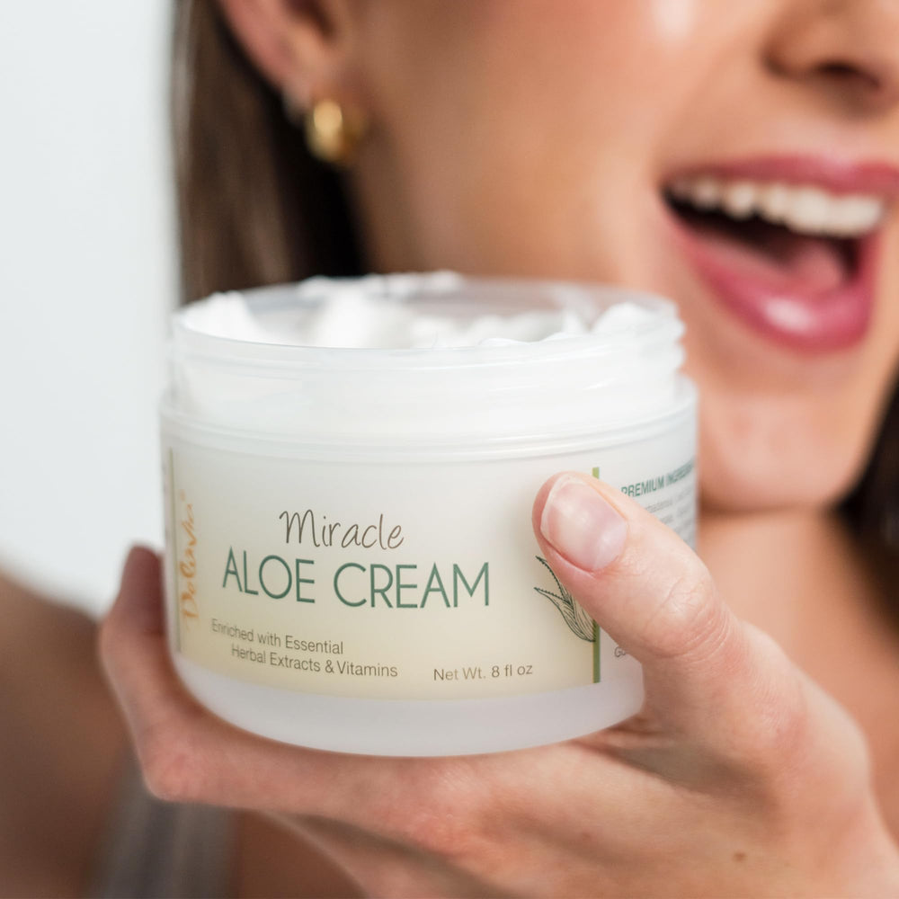 DELÚVIA Miracle Aloe Cream highlights organic aloe and vitamin E in creamy texture.