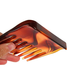 Denlydom mini detangler in use on hair for smooth grooming