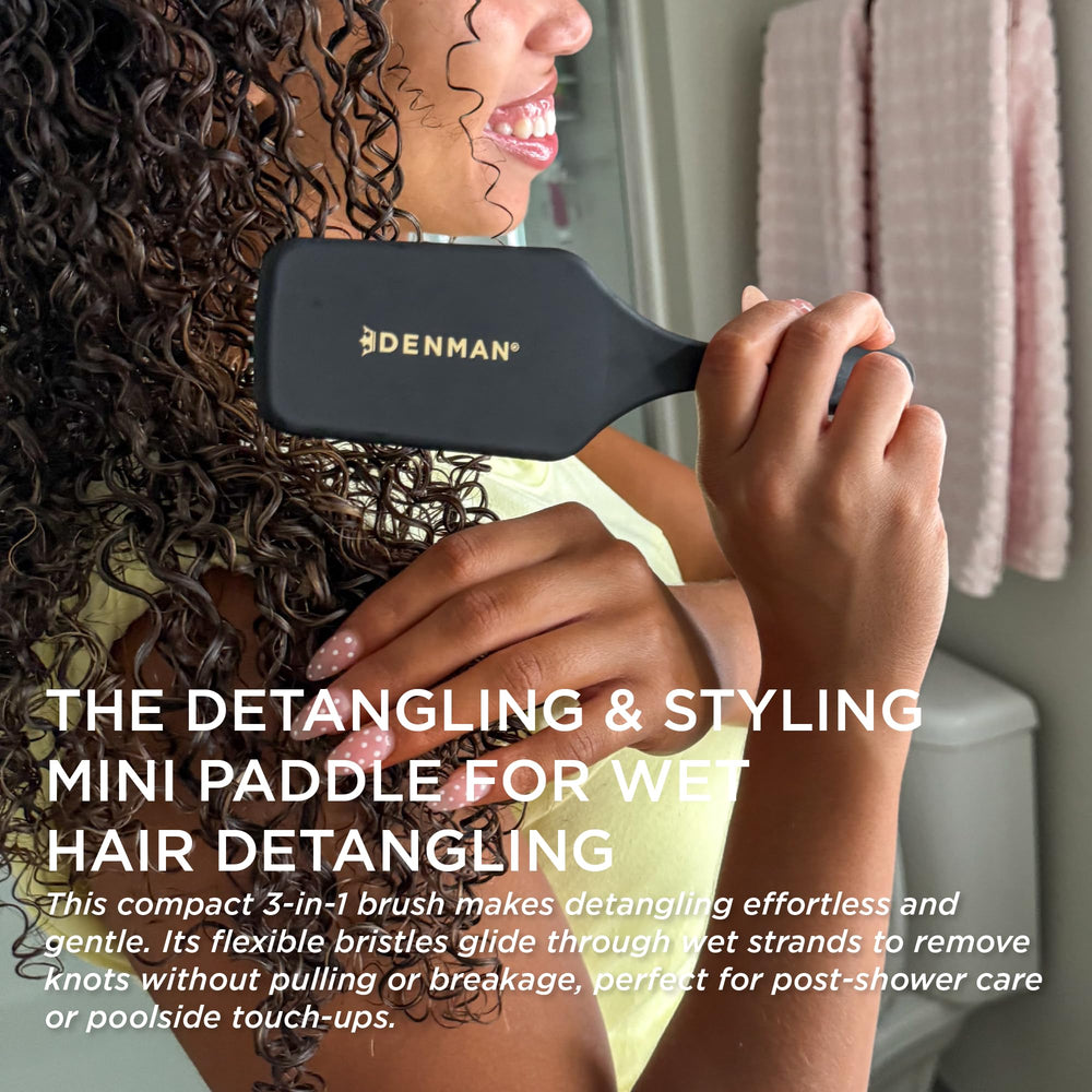 Denman D38 detangling brush on damp hair delivering knot-free detangling.
