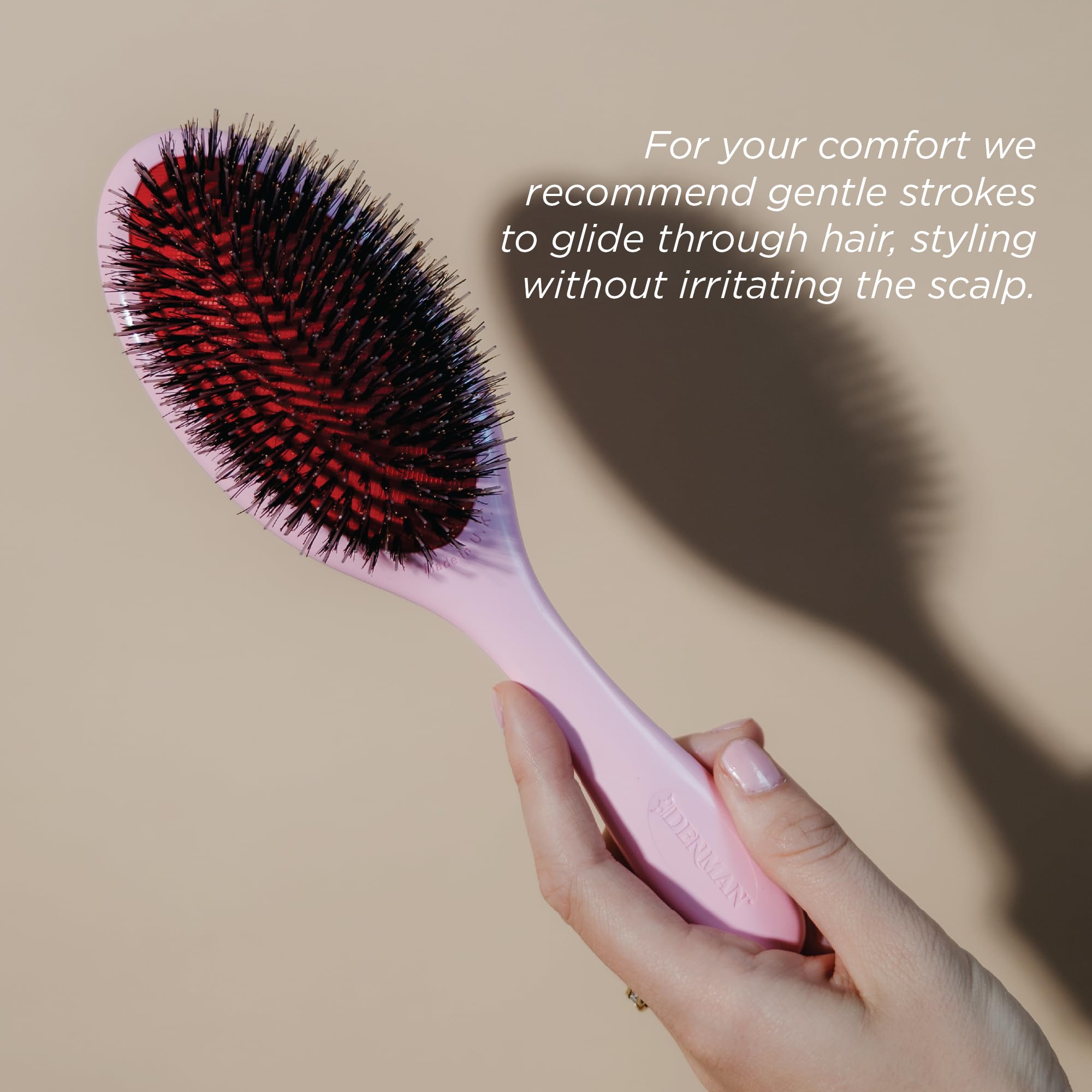 Denman D81M pink crush detangling action reduces pulling on tangled hair.