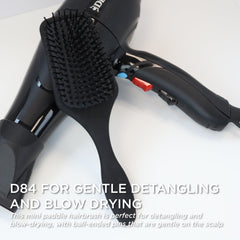 Denman Mini Paddle Brush compact handle for comfortable, non-slip grip.