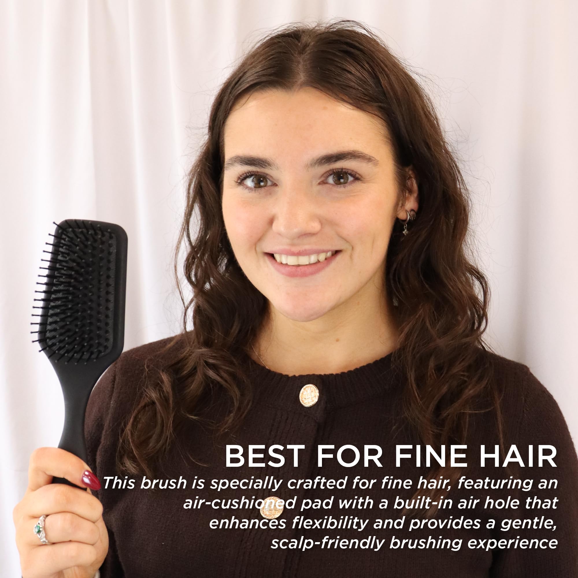 Denman Mini Paddle Brush detangles wet and dry hair with ease.