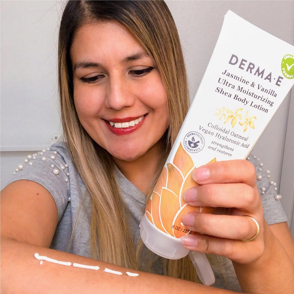Derma E applying lotion to elbows to relieve dryness.
