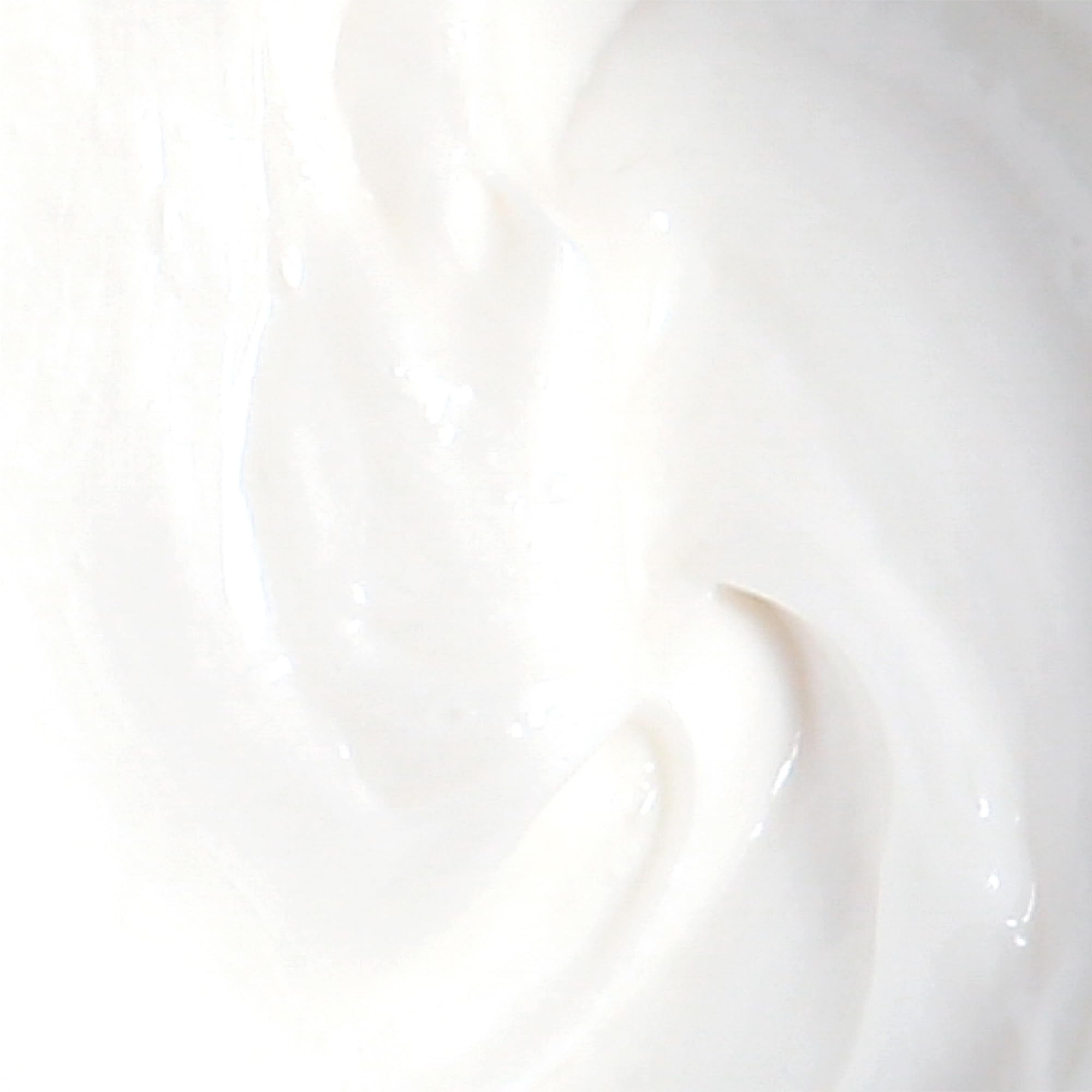 Derma E cream on skin demonstrates calm, hydrated skin after application.