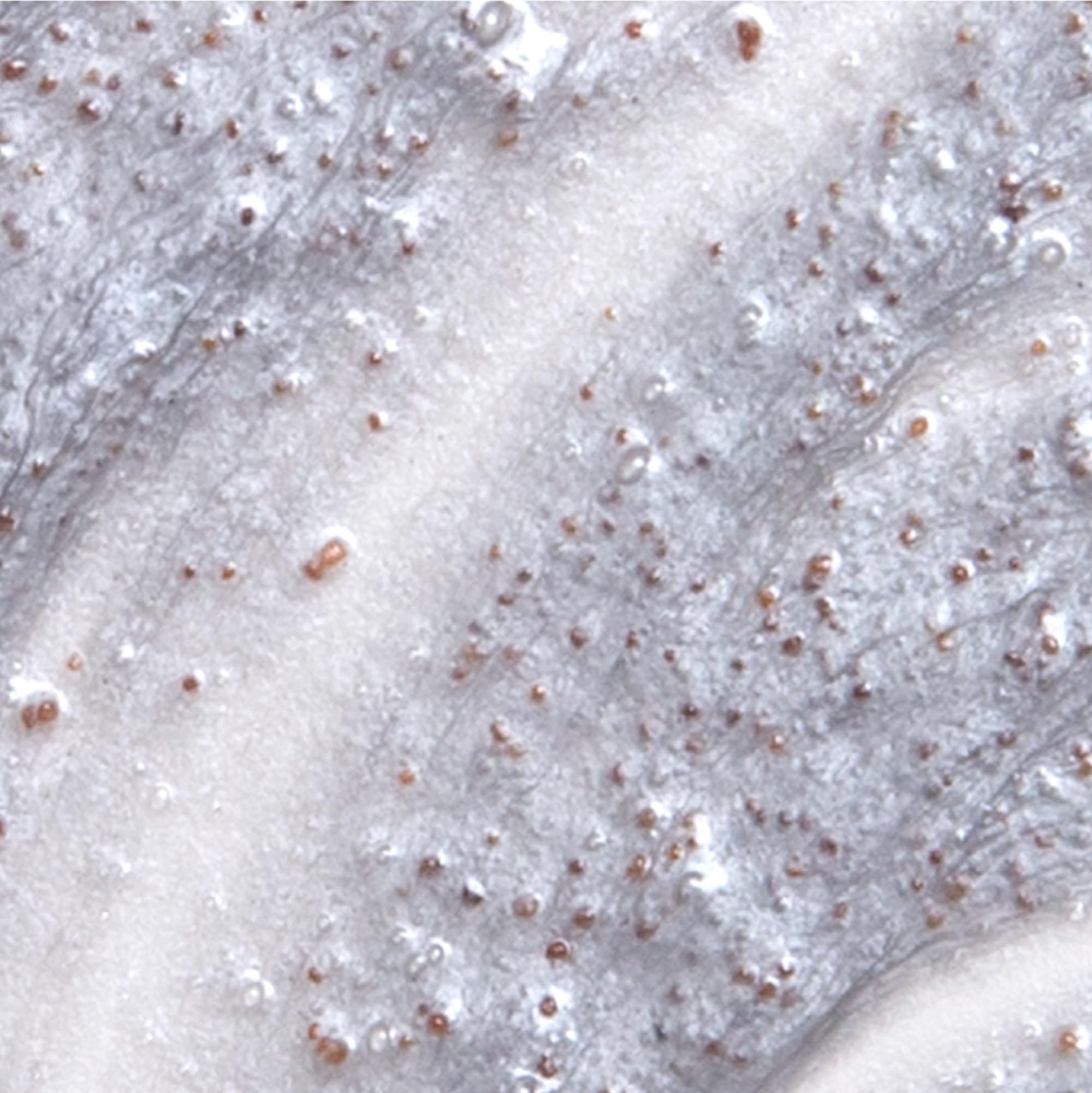 Derma E Purifying Daily Detox Scrub texture close-up illustrating fine exfoliating particles.