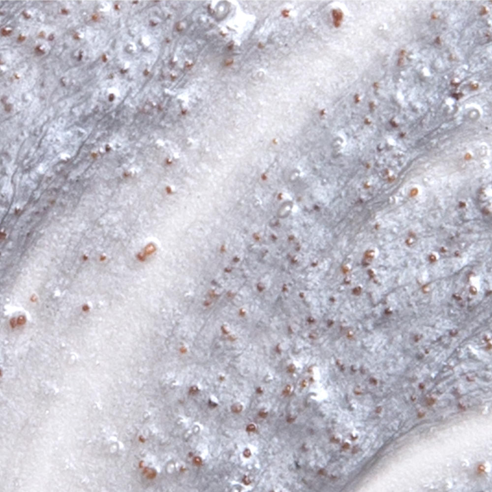 Derma E Purifying Daily Detox Scrub texture close-up illustrating fine exfoliating particles.