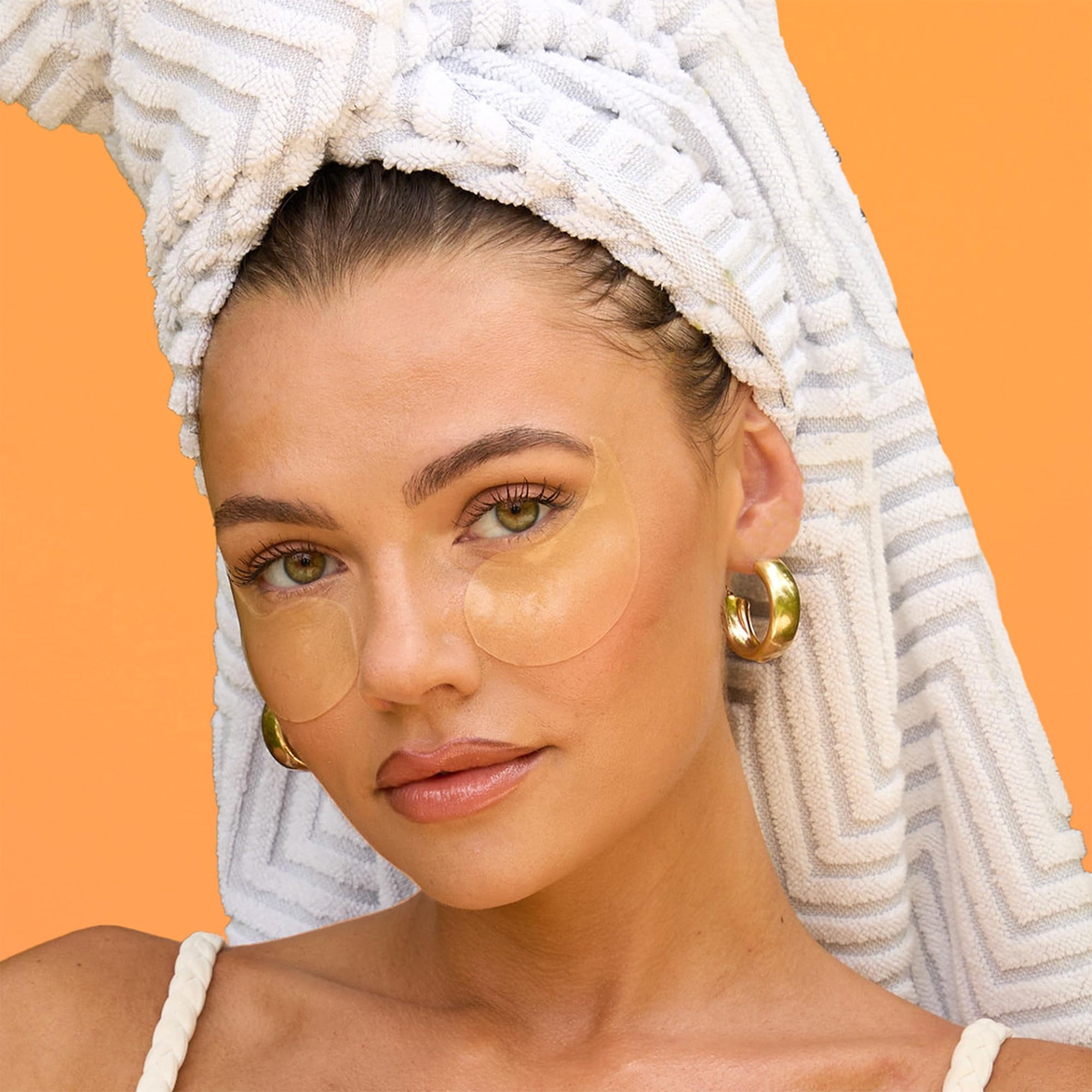 Under-eye patch on skin showing cooling depuffing effect with Derma E