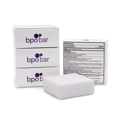 DermaHarmony cleansing bar in use, targeted acne care application.