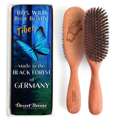 Desert Breeze Distributing boar bristle brush close-up shows tibet bristles for gentle detangling.
