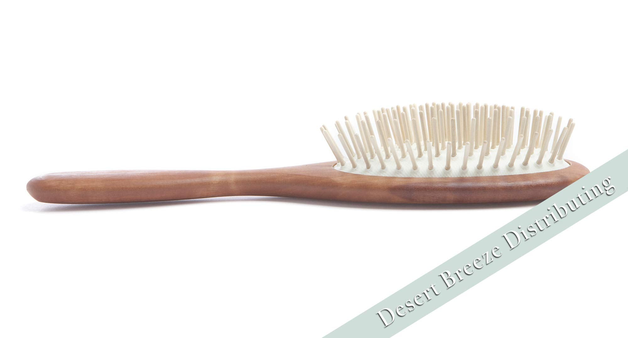 Desert Breeze oil-distribution brush aids even natural oils along hair shaft