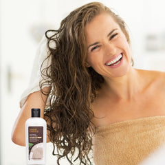 Desert Essence Coconut Soft Curls Hair Cream pump dispenser for even application on damp hair.