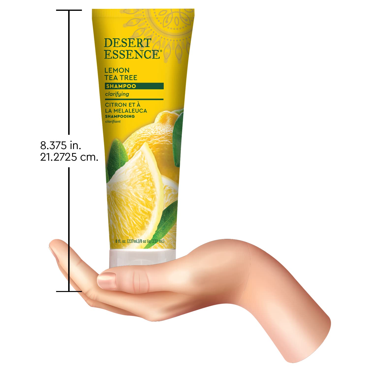 Desert Essence Lemon Tea Tree Shampoo splash by glass implies refreshing routine.