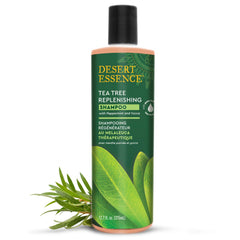 Desert Essence Tea Tree Oil Replenishing Shampoo bottle close-up for scalp refreshment