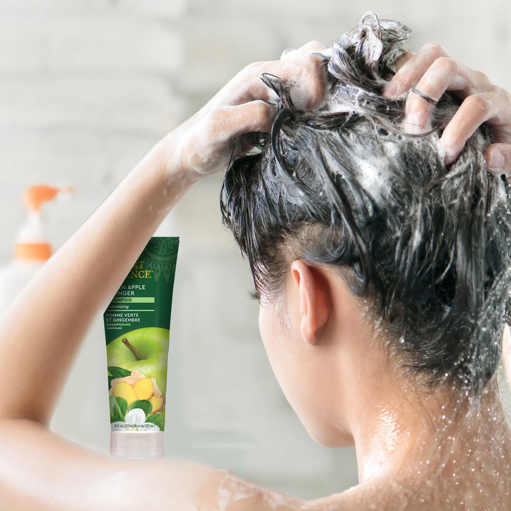 Desert Essence thickening shampoo on hair during application showing body and lift.