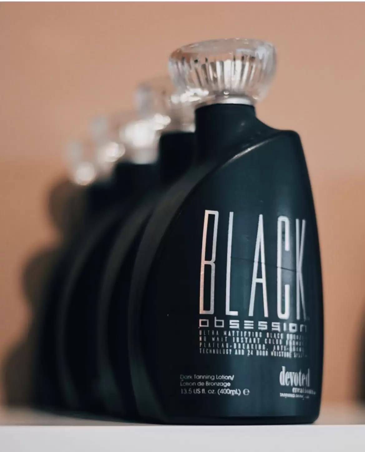 Devoted Creations Black Obsession tan shadow demonstrates natural tone balance.
