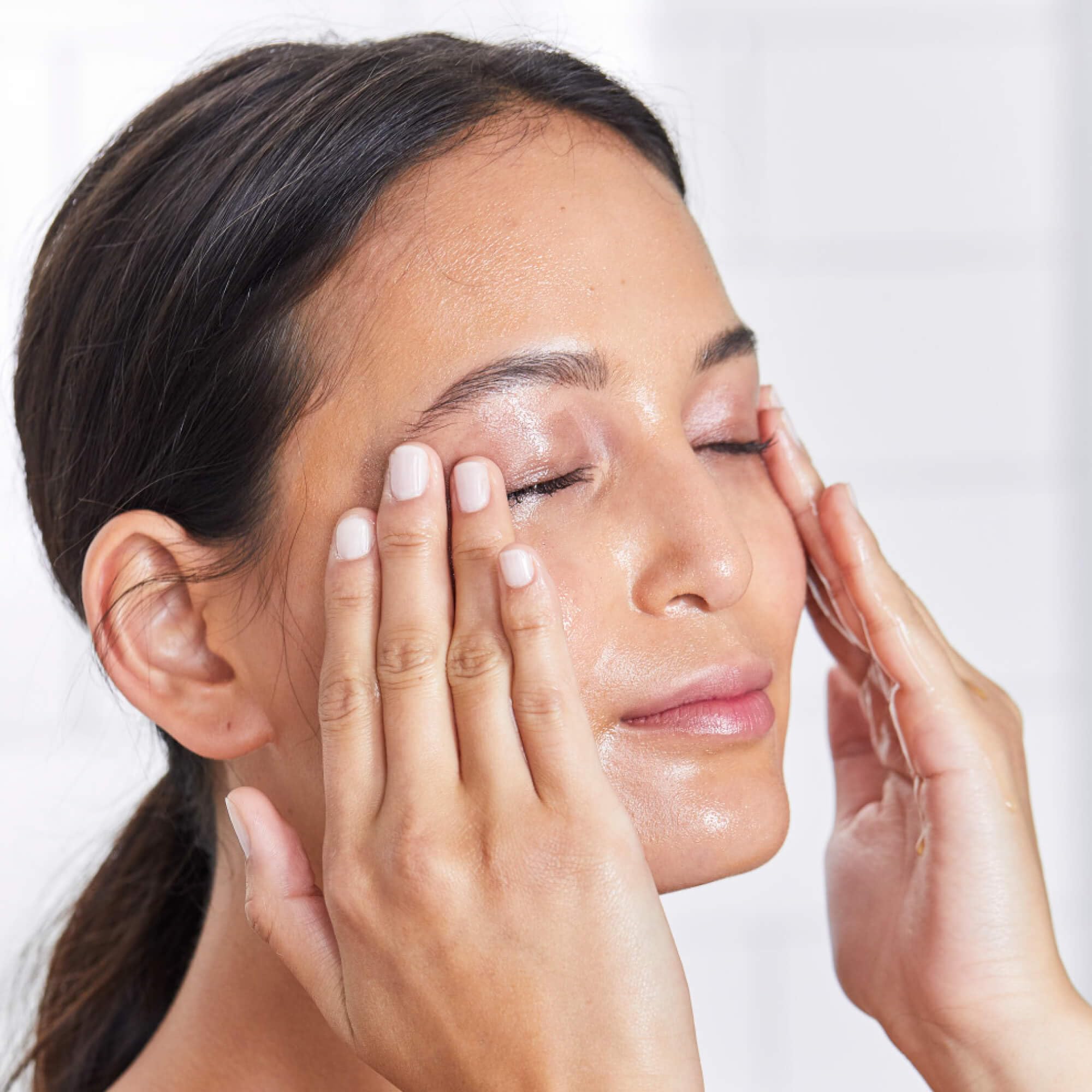 DHC Deep Cleansing Oil applied to dry face demonstrates oil-based makeup breakdown