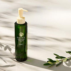 DHC Olive Cleansing Oil bottle applies sunscreen removal demo