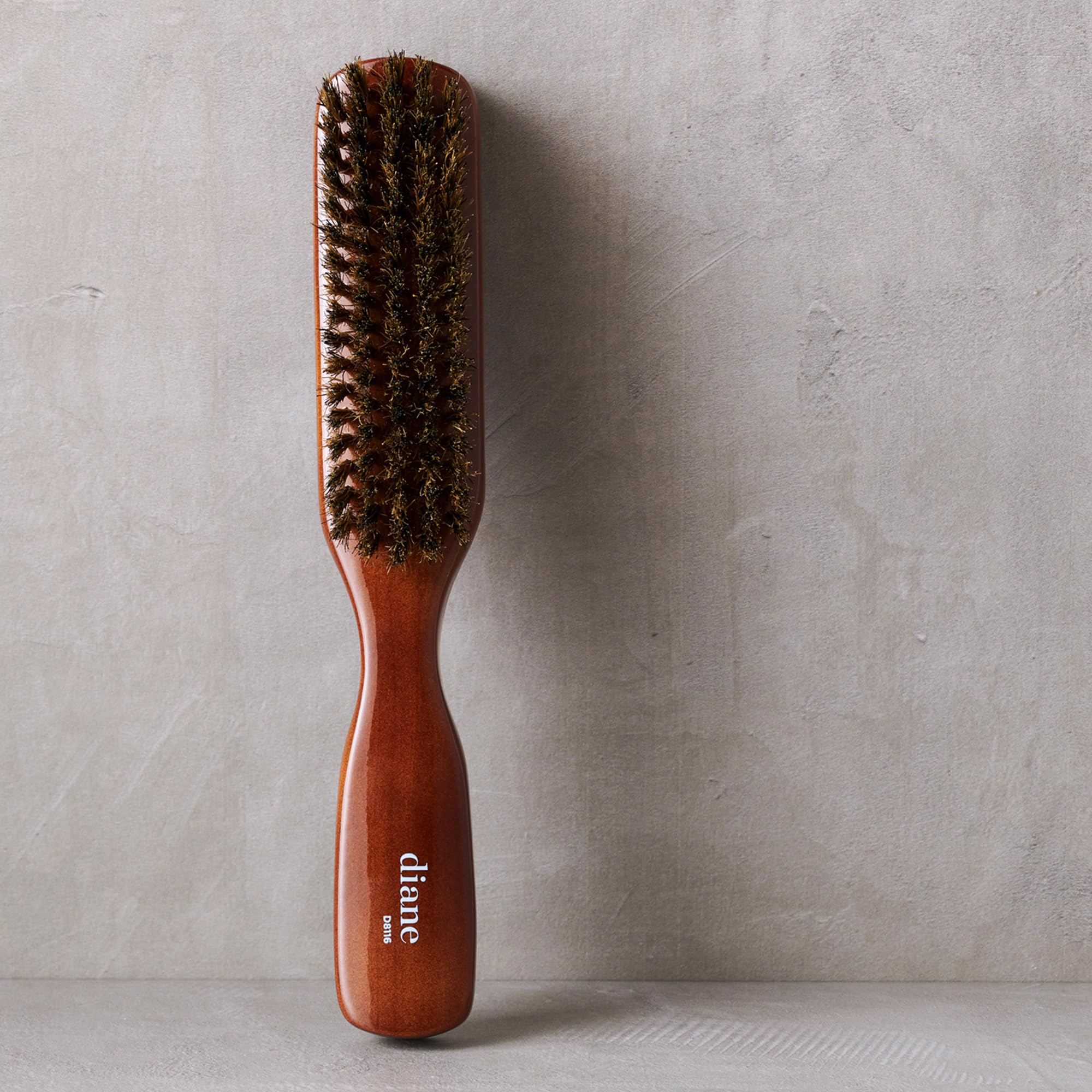 Diane Premium brush in hand demonstrates comfortable grip for everyday styling.