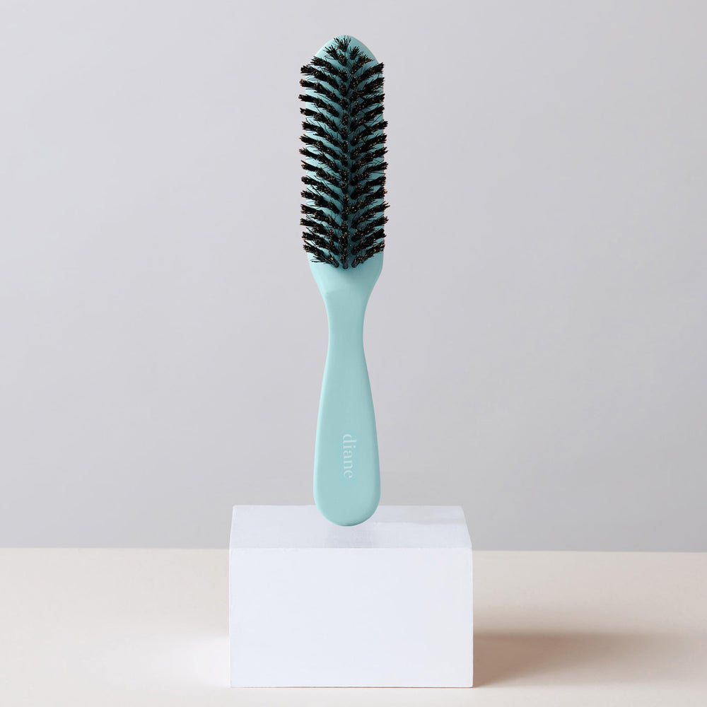 Diane smoothing brush slick-back styling for ponytails and updos.