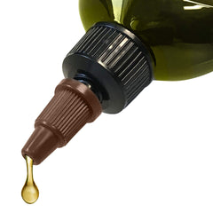 Difeel botella de aceite caliente vertido sobre el cabello para hidratación profunda