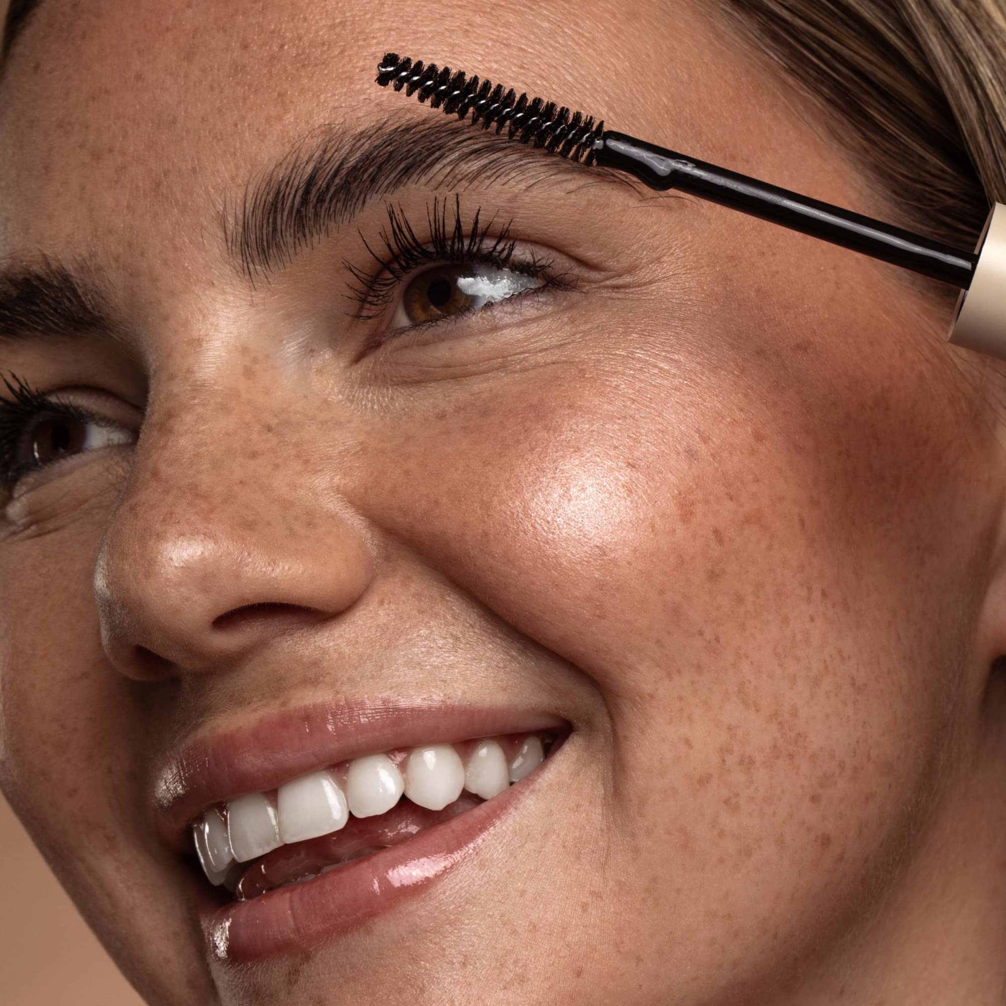 DIME Eyebrow Gel application demo showing upward stroke saturating brows.