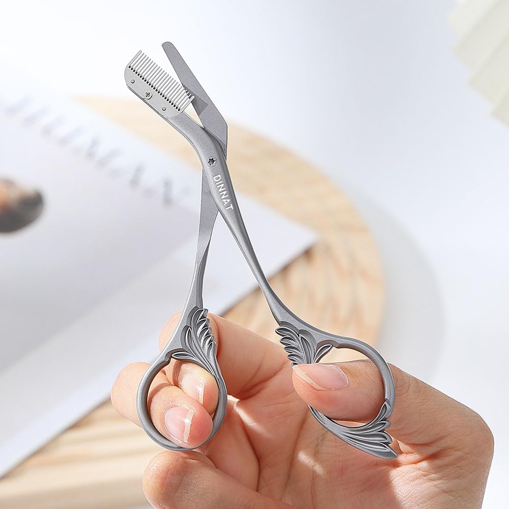 DINNAT Eyebrow Trimmer Scissor with Comb ergonomic handle closeup highlights comfortable grip for precise trimming