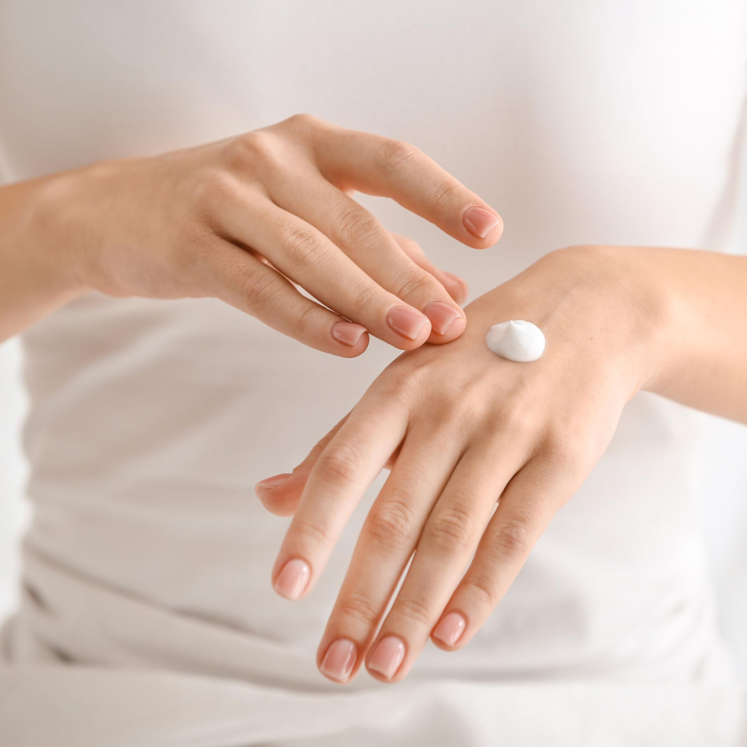 Dionis Goat Milk Verbena & Cream application on hand demonstrates quick absorption and smoothing hydration.