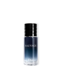 Dior Sauvage bottle cap close-up suggesting bold evening wear.