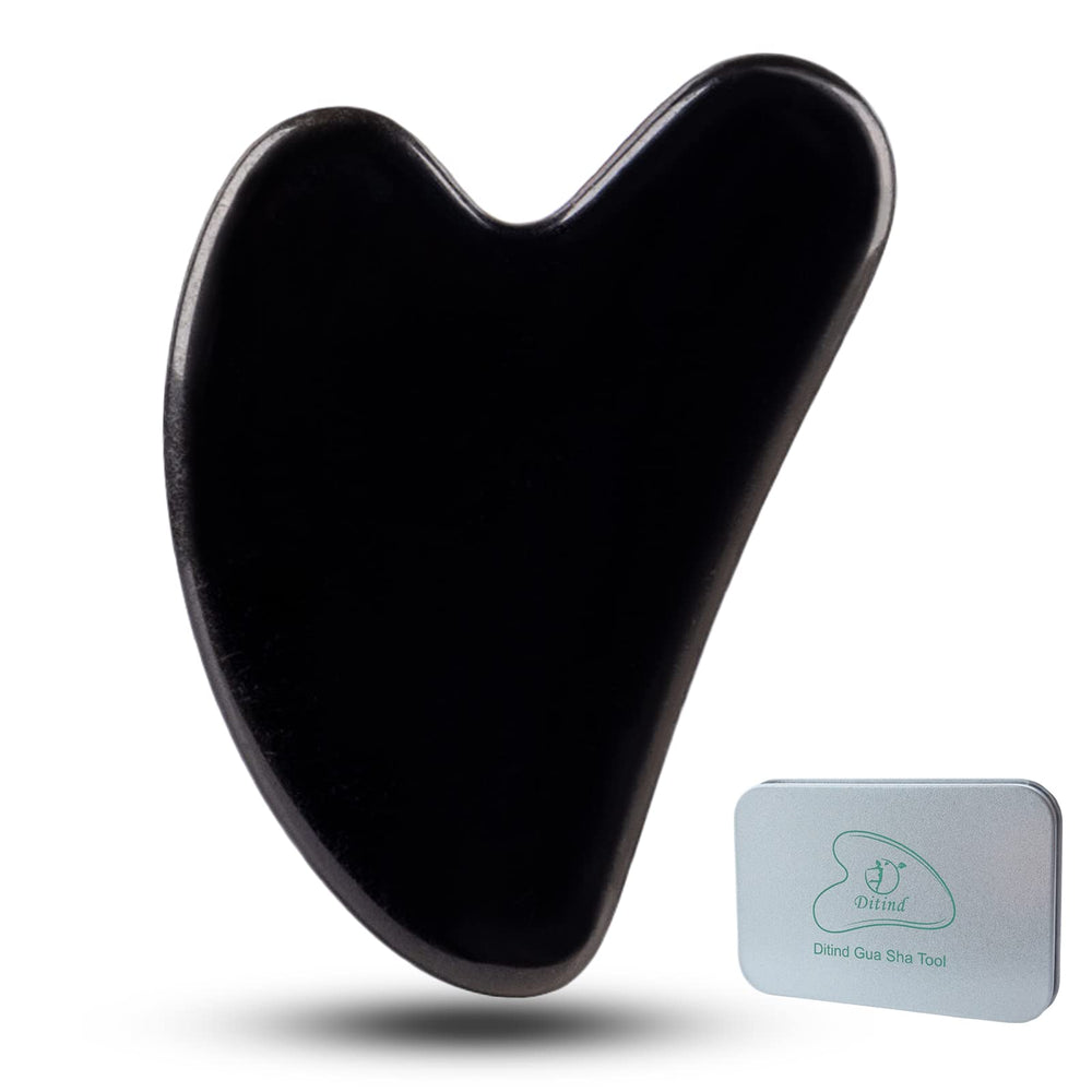 Ditind Gua Sha black obsidian face tool for relaxing facial massage and enhanced absorption.