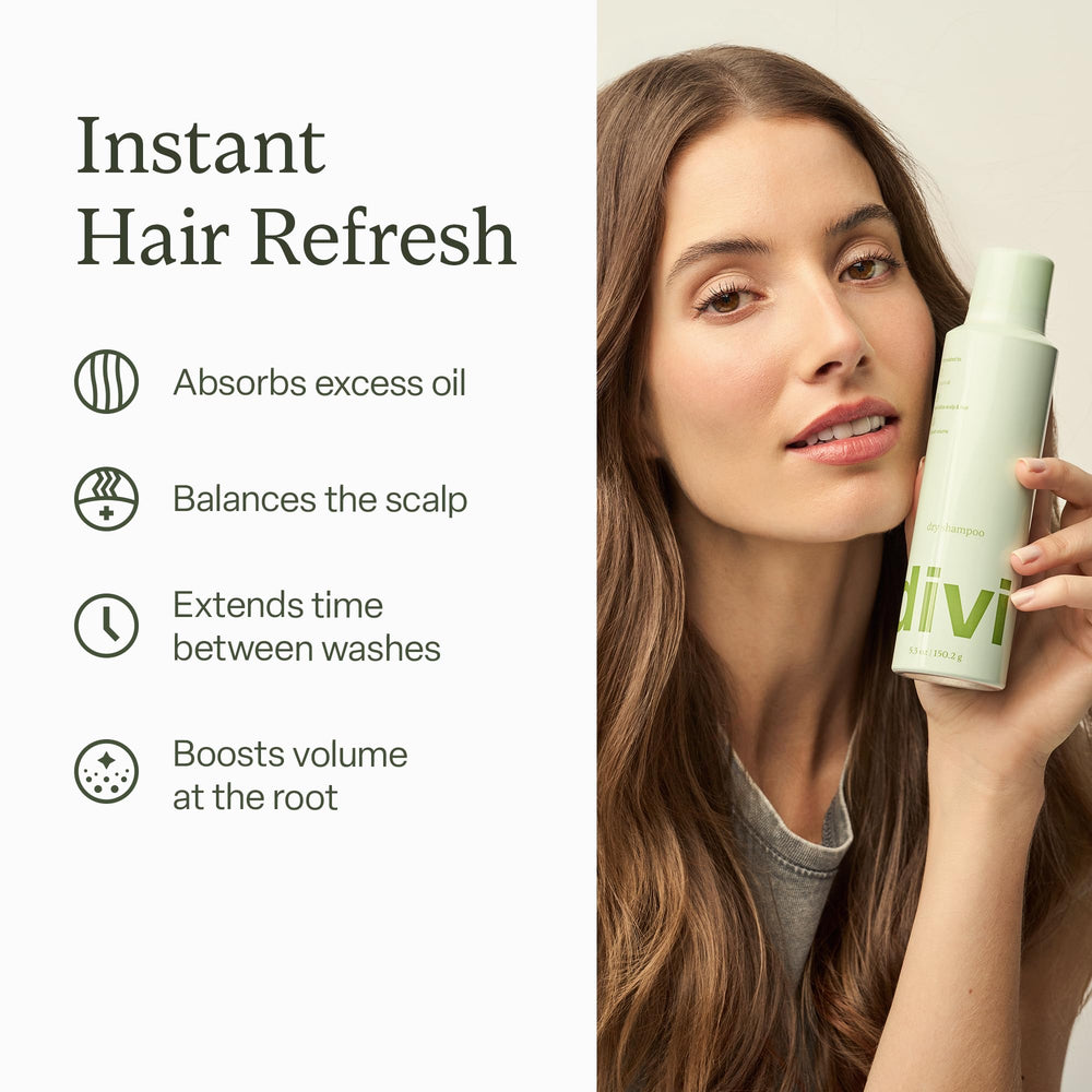 Divi dry shampoo spray application close-up shows precise root targeting