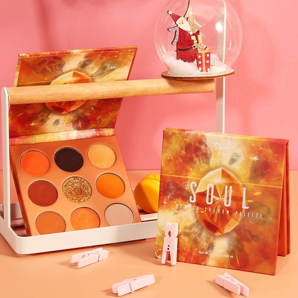 Docolor Orange Gemstone Palette open pan reveals eight orange shades and metallic sequins for shimmer looks.