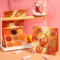 Docolor Orange Gemstone Palette open pan reveals eight orange shades and metallic sequins for shimmer looks.