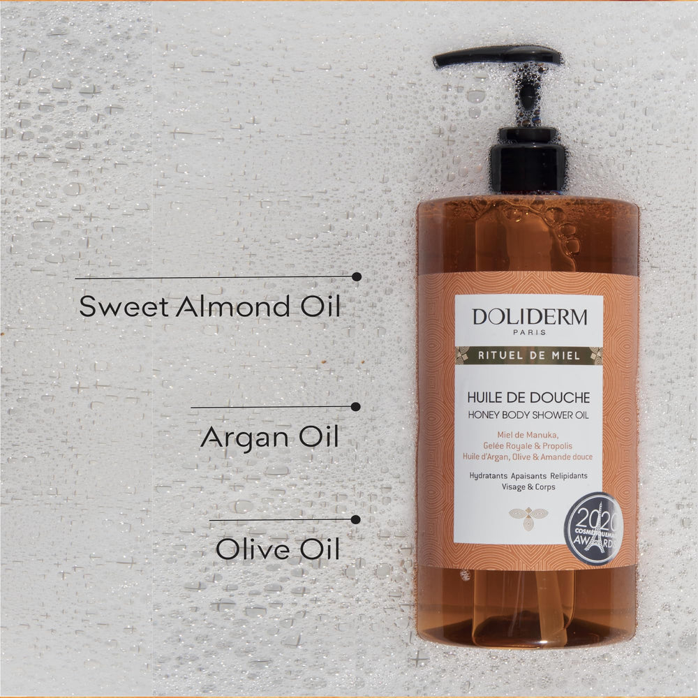 Doliderm Rituel de Miel honey drop on palm highlighting nourishing oils.