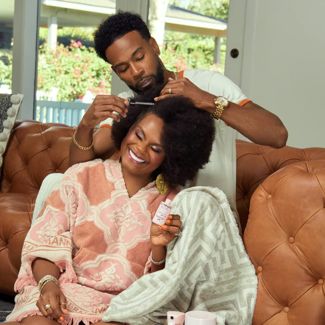 Donna's Recipe Strength Hair Oil bottle – spa-like at-home scalp massage for relaxation.