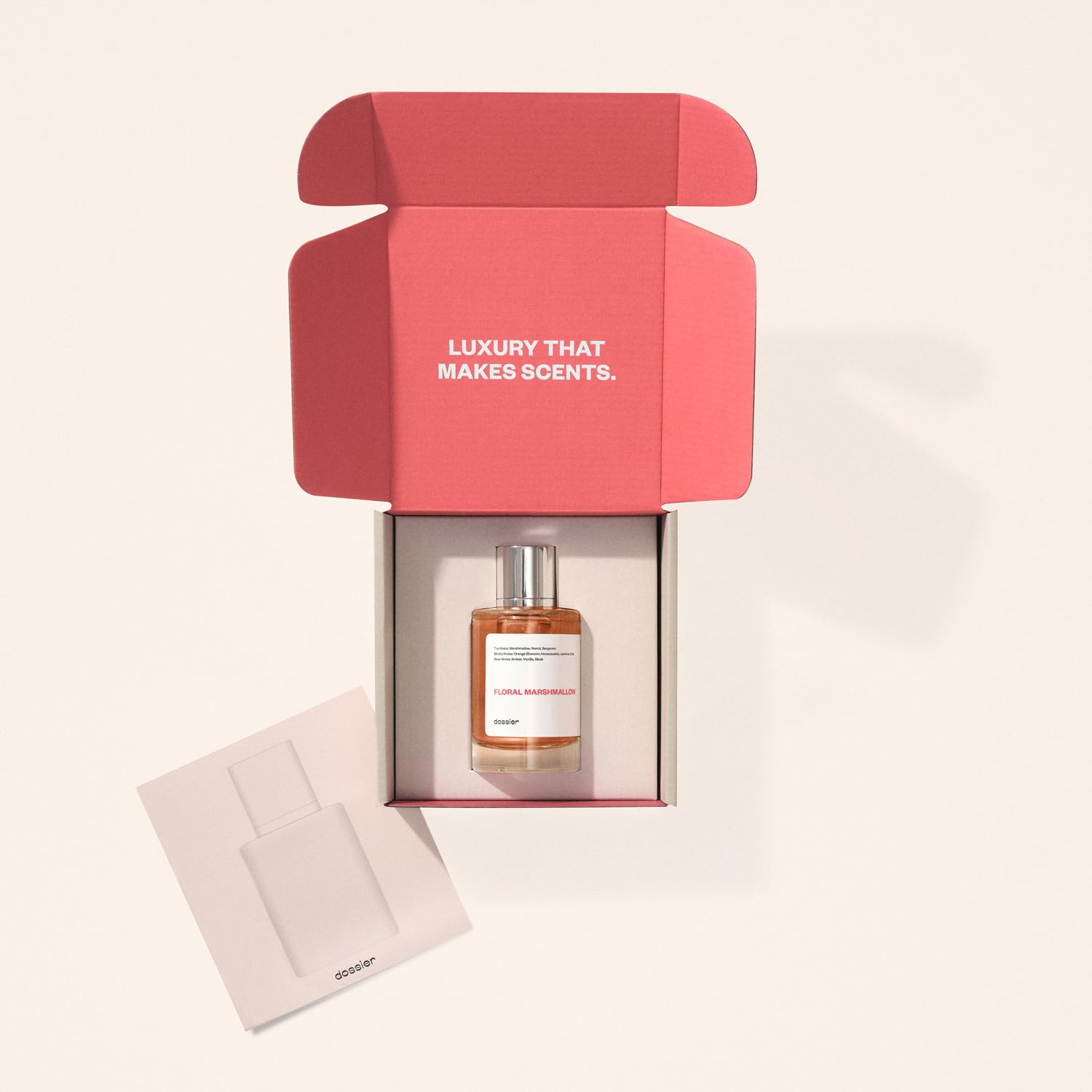 Dossier Floral Marshmallow base-notes image suggests lasting amber, vanilla, and musk warmth.