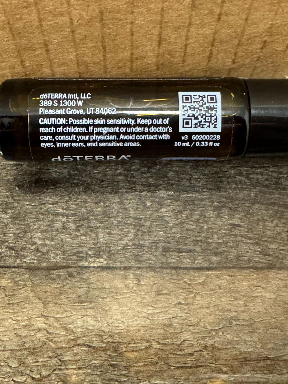 doTERRA Peppermint Touch temple-application captured for quick relief.