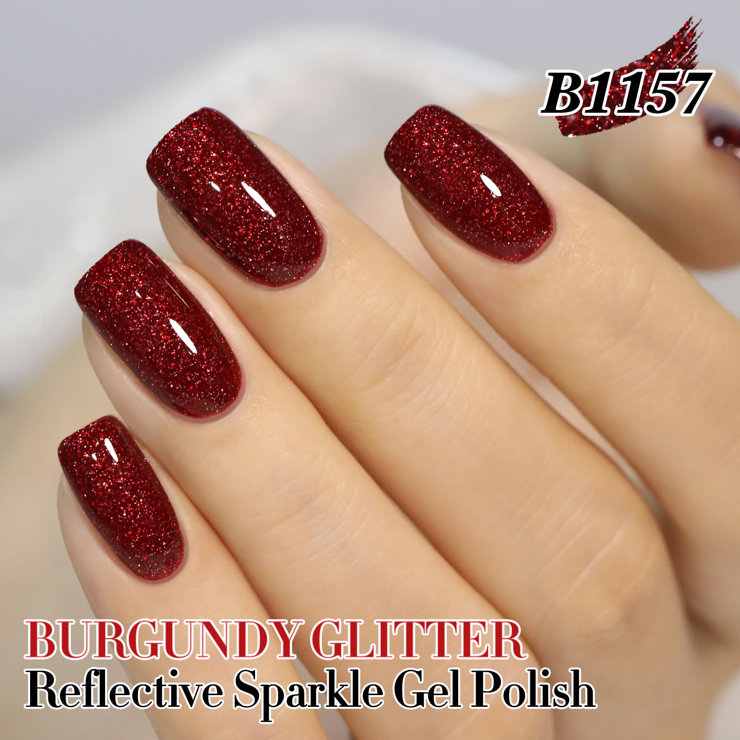 Double Rhythm burgundy glitter nails close-up demonstrates glossy, long-lasting finish