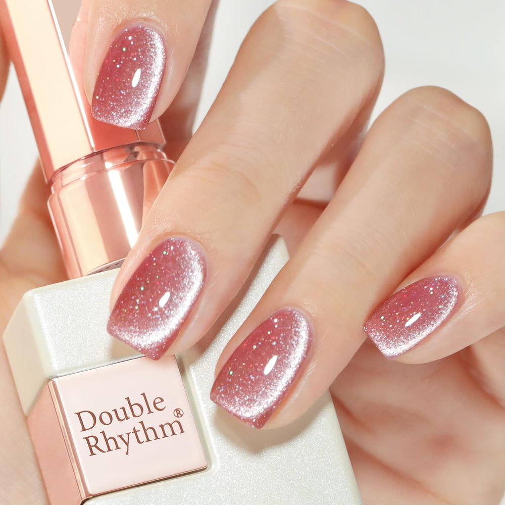 Double Rhythm ice glass cat eye pink 15ml bottle under light for salon-like shimmer.
