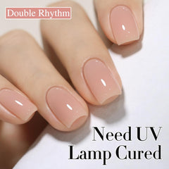 Double Rhythm milky almond bottle warming demonstrates ideal viscosity for smooth application.