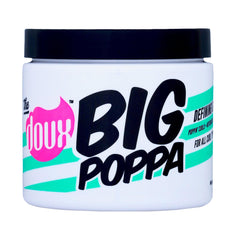 The Doux BIG POPPA bottle closeup showing sleek packaging for frizz control
