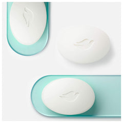 Dove bath bars closeup smooth rectangular bars signaling easy lather for gentle wash