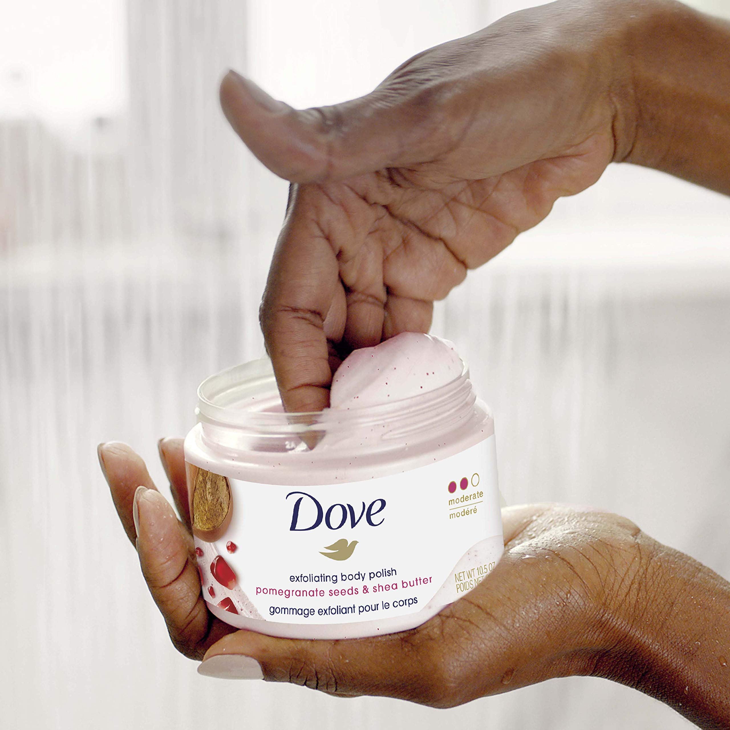 Dove Exfoliating Body Polish showing the moisture-rich cream formula on skin