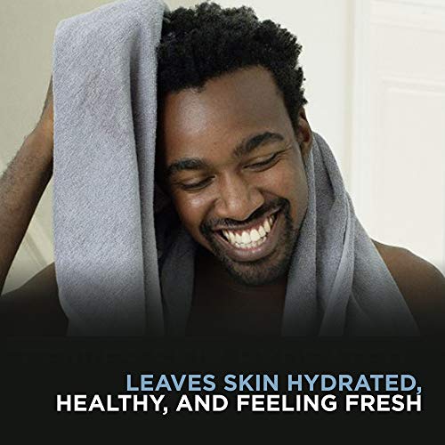 Dove Men Clean Comfort bottle on bathroom shelf promoting hydration and skin comfort.