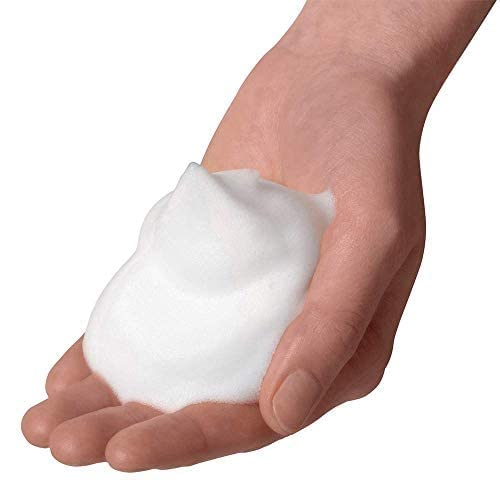 Dove NutriumMoisture bottle with pump captured during shower for nourishing, skin-softening lather